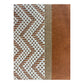 close-up view of the woven fabric from a bag, featuring a white zigzag pattern on a burnt orange background with a vertical beige stripe.