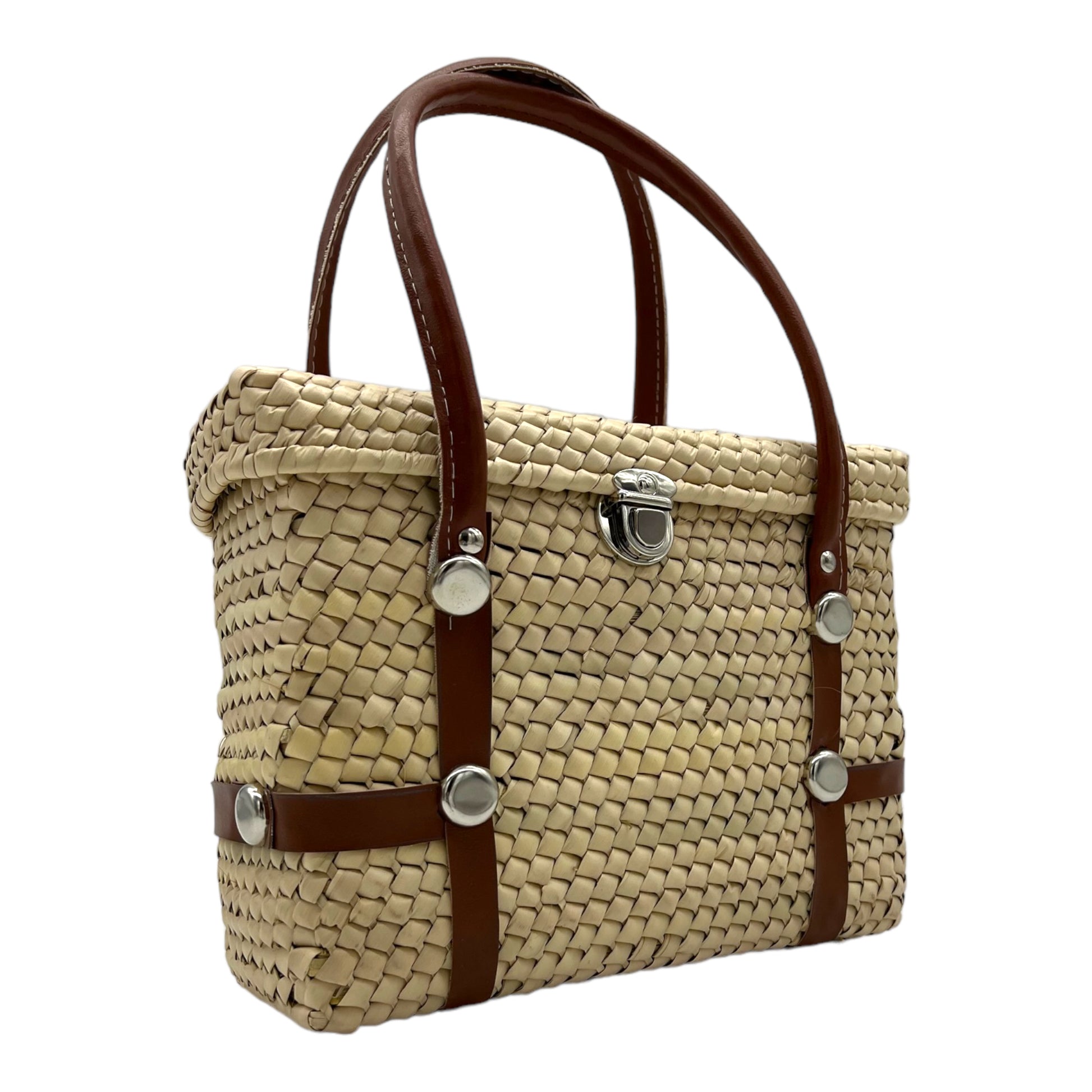 woven palm handbag with brown vegan leather straps and a silver clasp, shown from an angled view