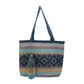 tote bag with a blue base and multicolored horizontal stripes, featuring a diamond pattern in the center and adorned with a layered tassel