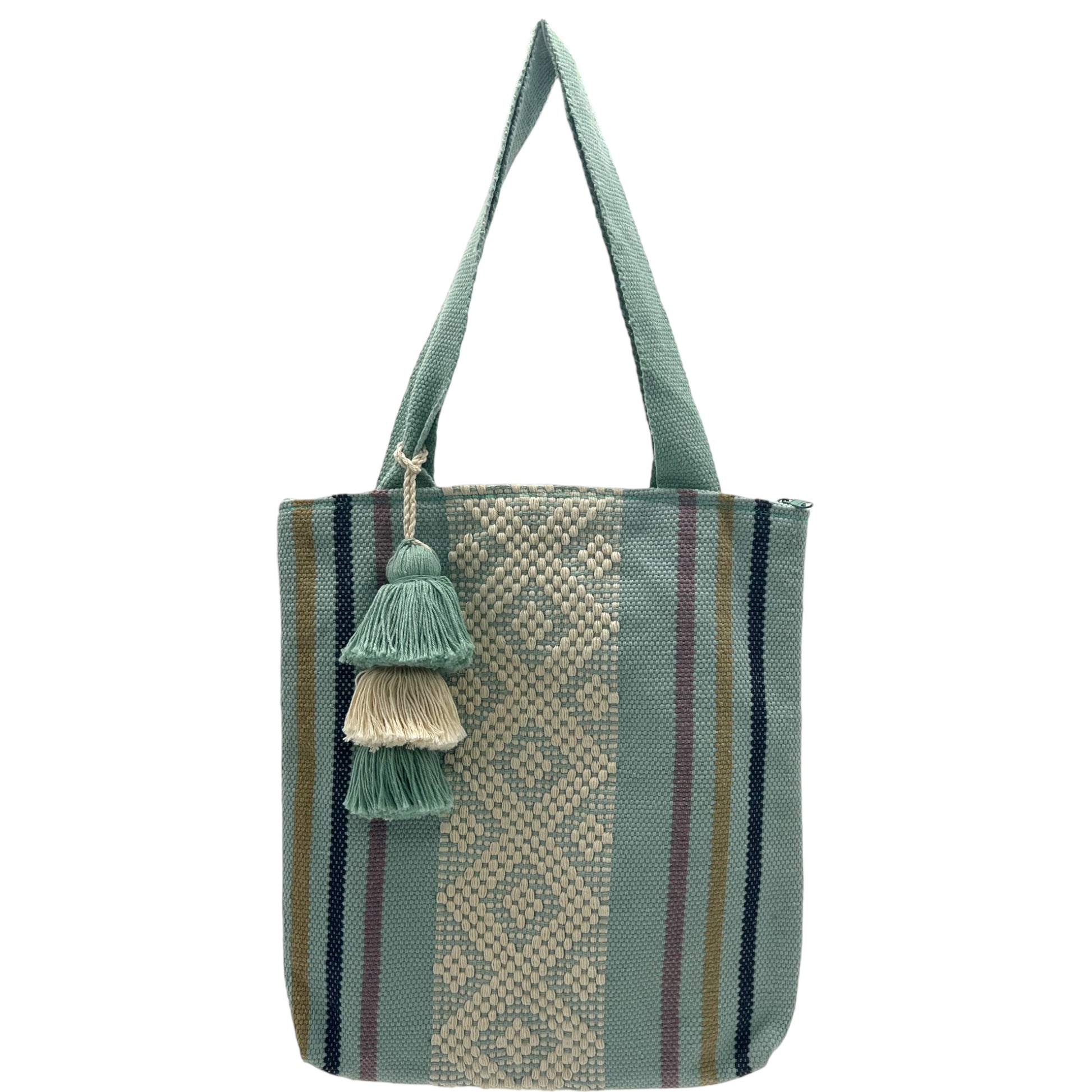 light teal tote bag with vertical stripes in various colors and a central band of geometric woven patterns. It features a matching tassel