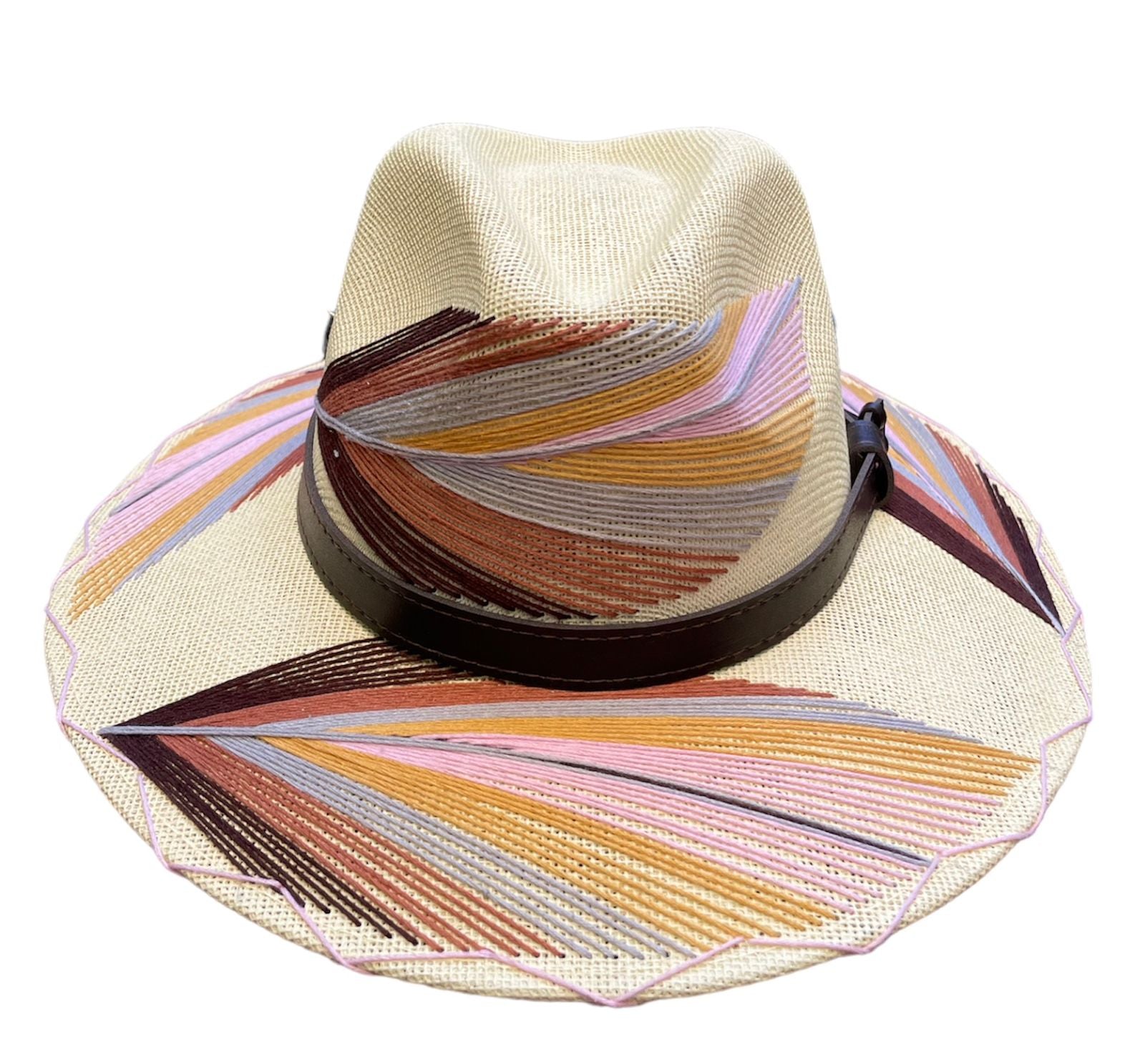 beige hat with multicolored palm frond designs in shades of brown, orange, pink, and purple, and a brown leather band.