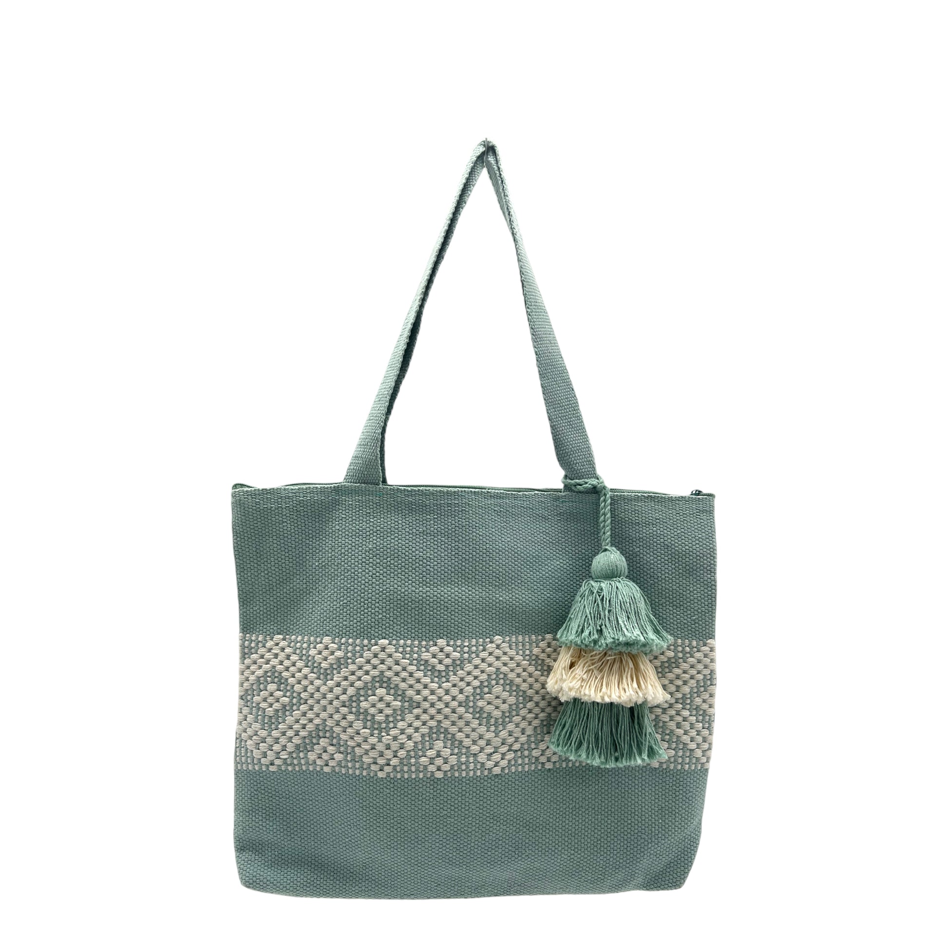 light green tote bag with a horizontal band of geometric woven patterns in cream and a matching tassel