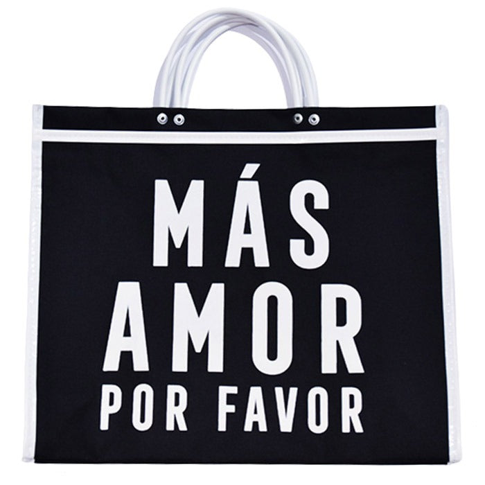 black tote bag with white handles and "MÁS AMOR POR FAVOR" in large white letters.