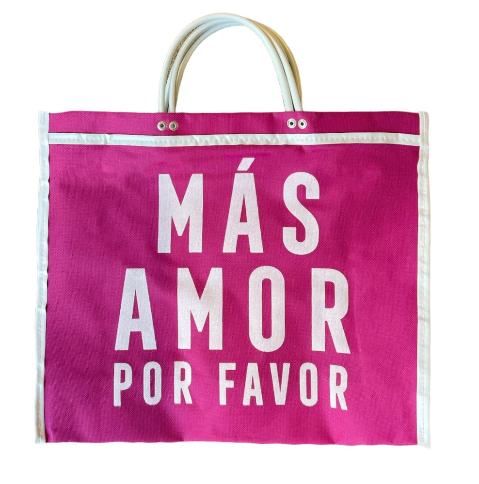 fuchsia tote bag with white handles and "MÁS AMOR POR FAVOR" in large white letters.