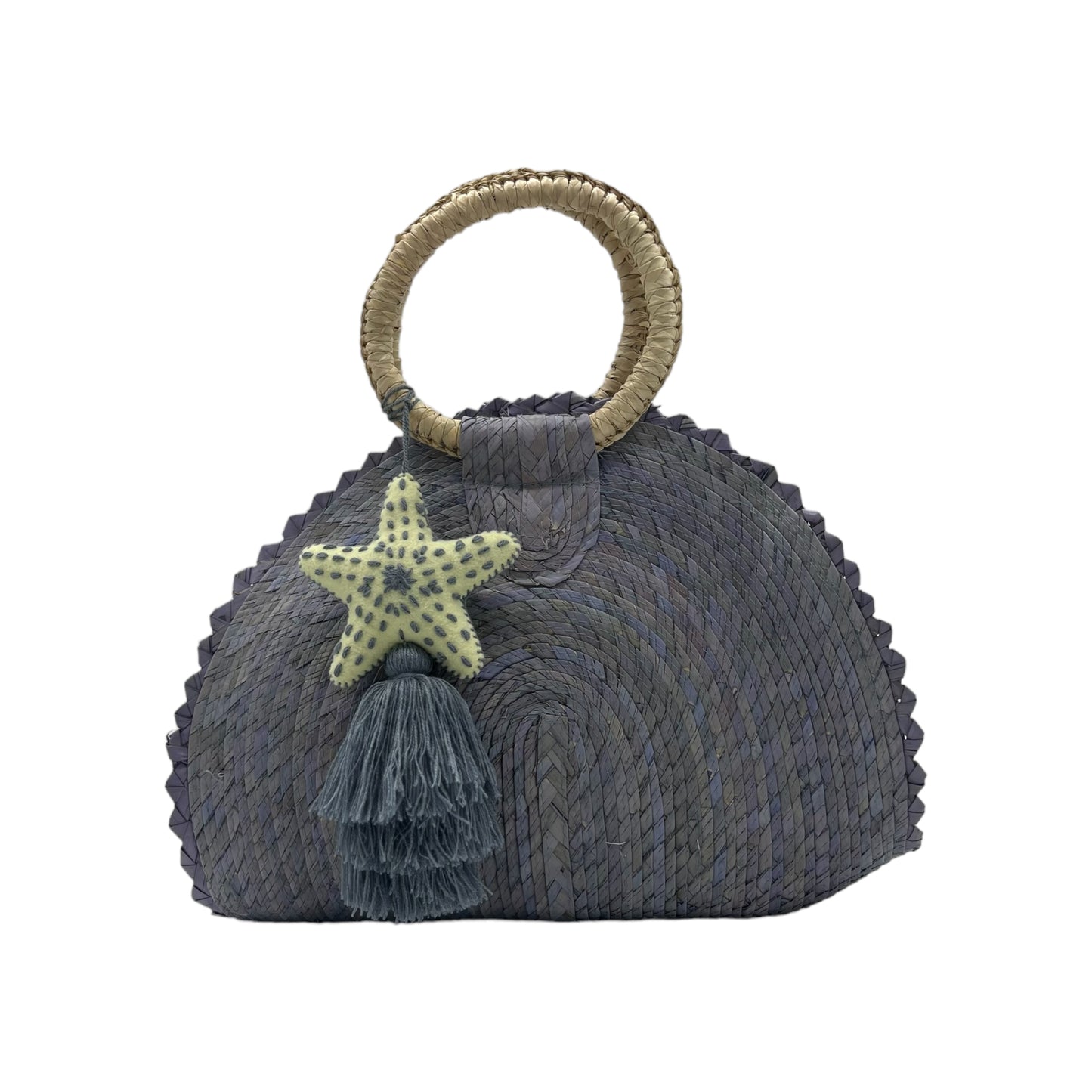 lavender woven palm handbag with a circular handle wrapped in light material. The bag features a starfish-shaped ornament and a matching tassel hanging from the front.