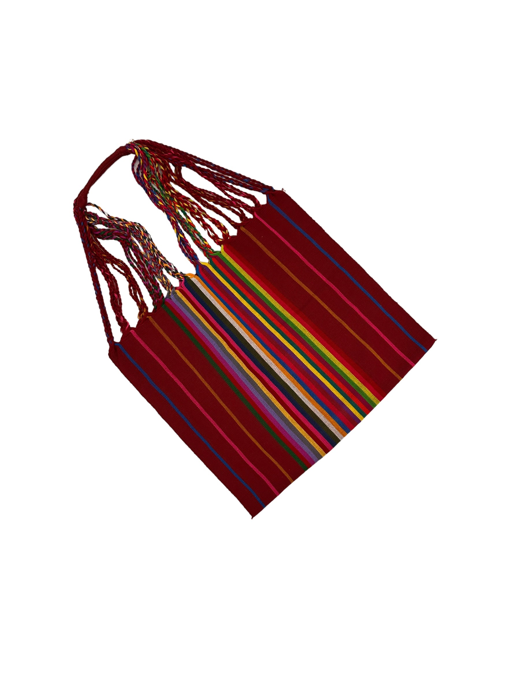 handwoven tote featuring red with blue, green, and pink stripes, and a central section with multicolored stripes. The straps are braided with various colors.