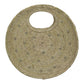 handbag made of natural fibers. It has a circular handle cut-out at the top and is decorated with small silver metallic studs arranged in a spiral pattern.