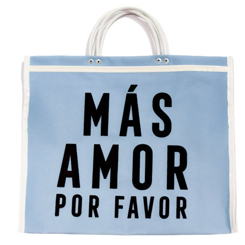 sky blue tote bag with white handles and the words "MÁS AMOR POR FAVOR" printed in large black letters.