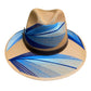 brown hat with blue and white palm frond designs and a brown leather band.