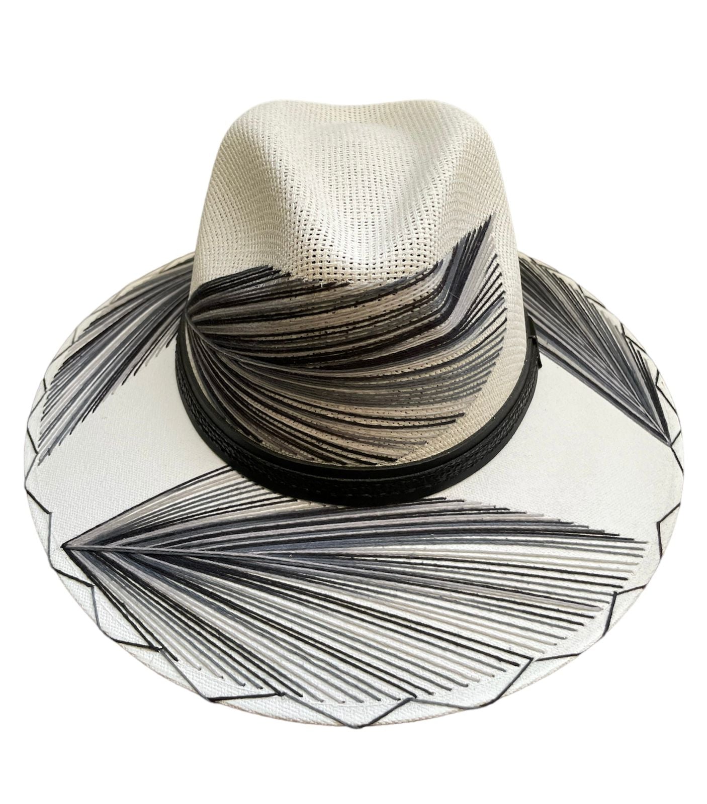 white hat with black and gray palm frond designs and a black leather band.