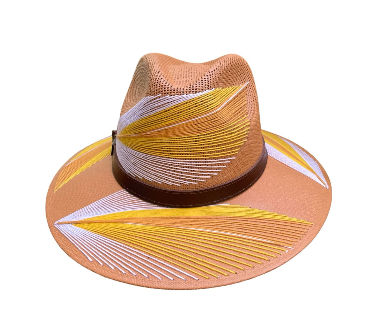 tan hat with yellow and white palm frond designs and a brown leather band.