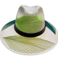 white hat with green, lime green, and teal palm frond designs, featuring a black leather band.