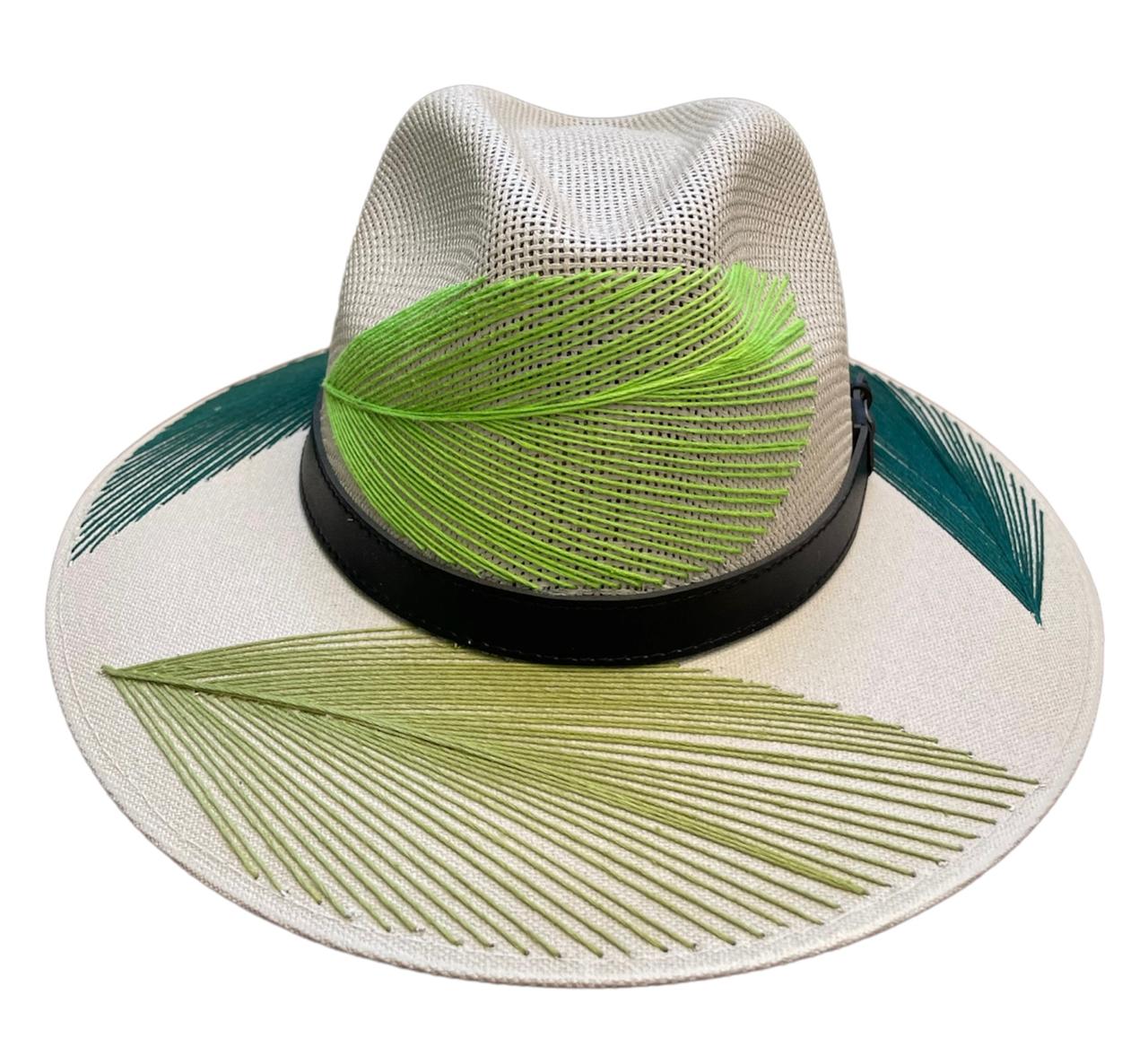 white hat with green, lime green, and teal palm frond designs, featuring a black leather band.