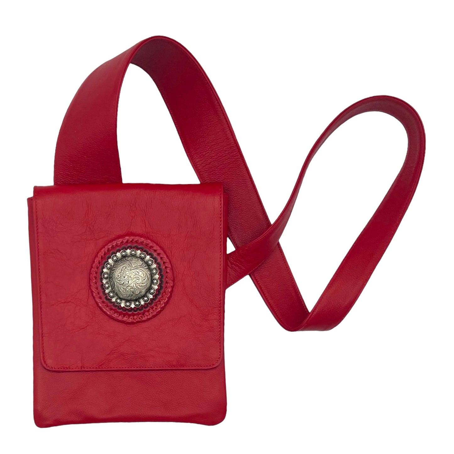 red leather crossbody bag with a wide strap. The bag features a circular decorative medallion on the front flap.