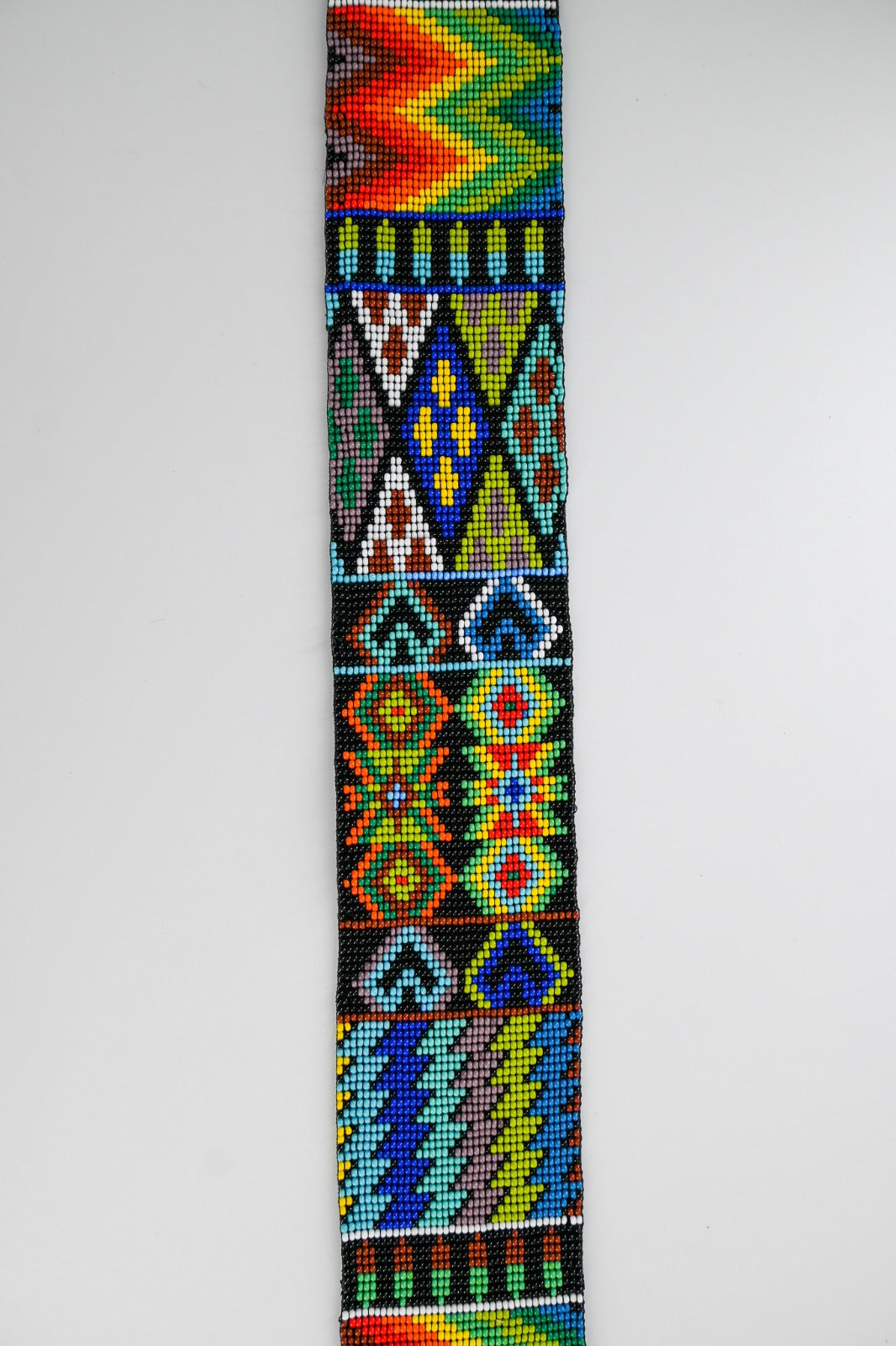 colorful beaded strap with intricate patterns, suitable for cameras or guitars, featuring traditional Huichol designs from Mexico.