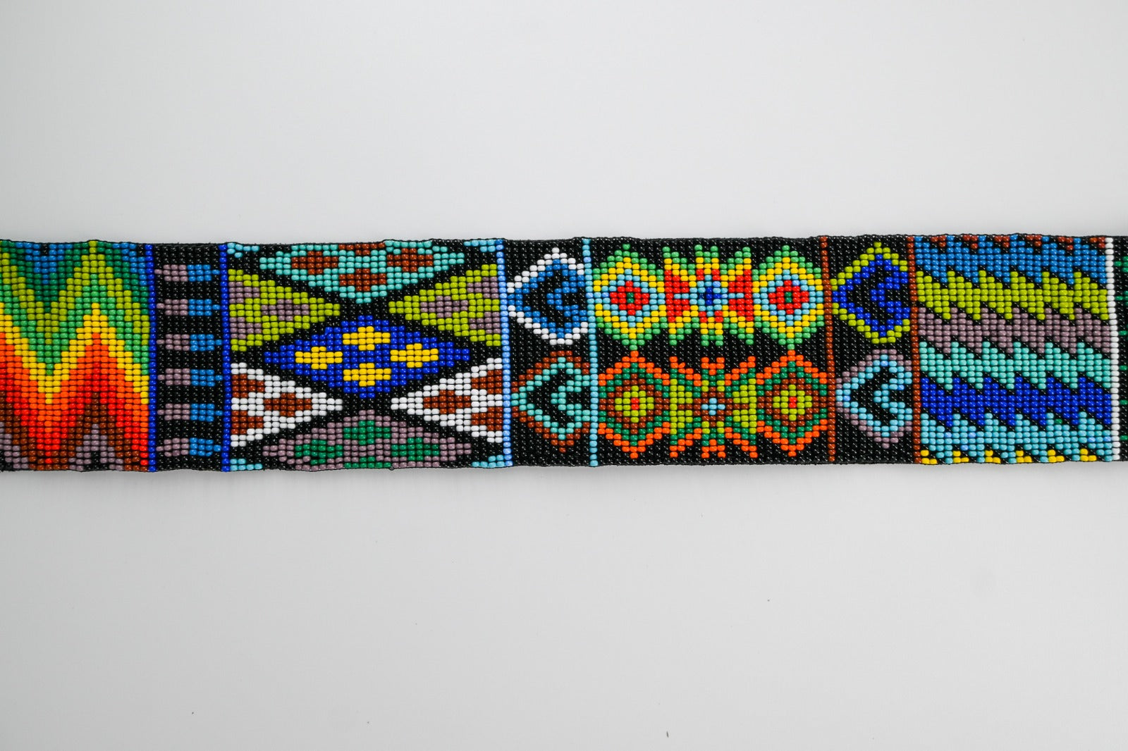 colorful beaded strap with intricate patterns, suitable for cameras or guitars, featuring traditional Huichol designs from Mexico.