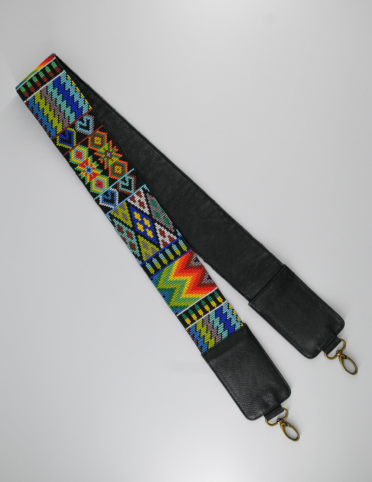 colorful beaded strap with intricate patterns, suitable for cameras or guitars, featuring traditional Huichol designs from Mexico.