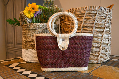 woven handbag with a dark brown body and a circular handle