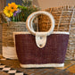 woven handbag with a dark brown body and a circular handle