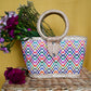 woven handbag with a colorful, patterned body and a circular handle