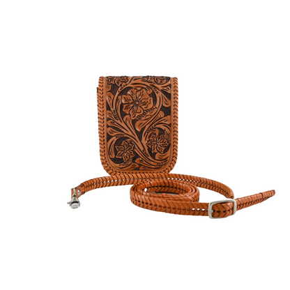 honey-colored leather crossbody sling bag with floral carvings and a braided, adjustable strap. It features a magnetic snap closure and a back pocket for easy access.