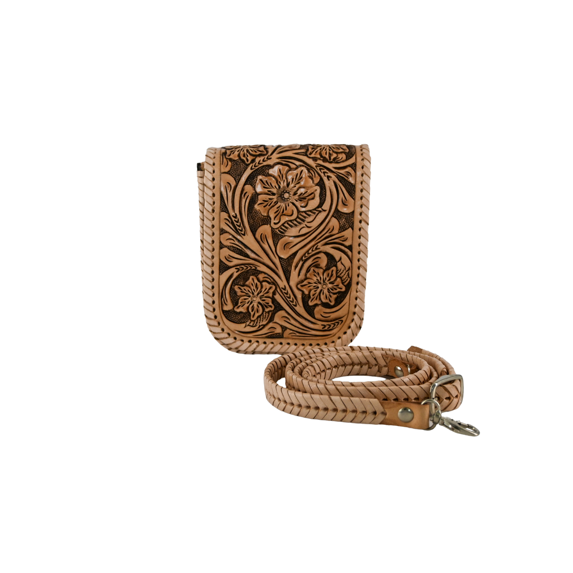 nude-colored leather crossbody sling bag with floral carvings and a braided, adjustable strap. It features a magnetic snap closure and a back pocket for easy access.