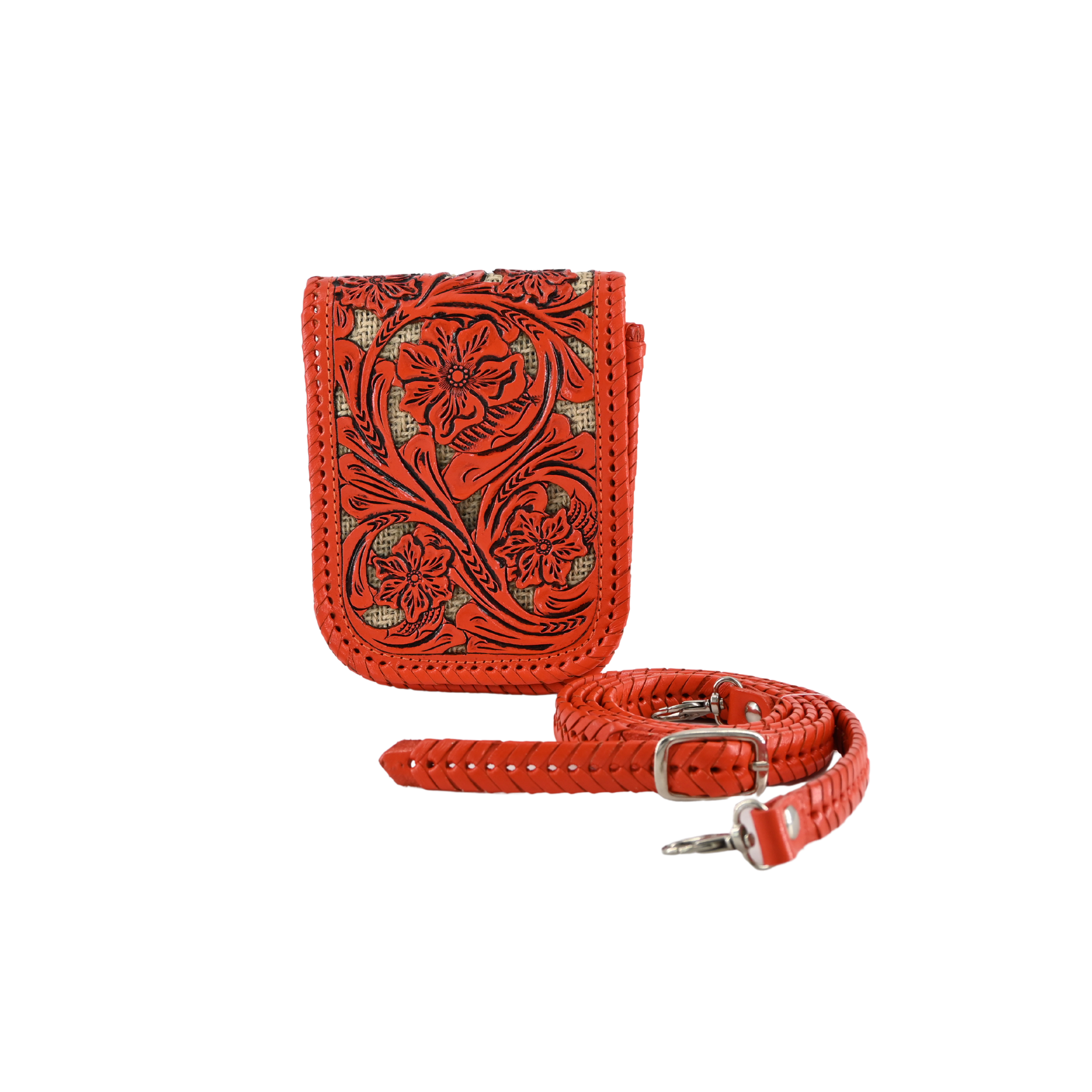 orange leather crossbody sling bag with floral carvings and a braided, adjustable strap. It features a magnetic snap closure and a back pocket for easy access.