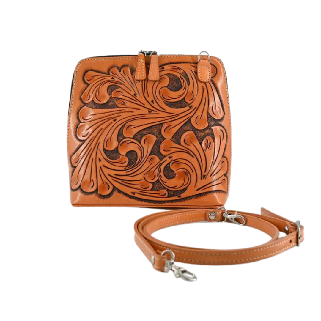 honey-brown leather shoulder bag with hand-carved floral details, an adjustable strap, and a zip-around closure.