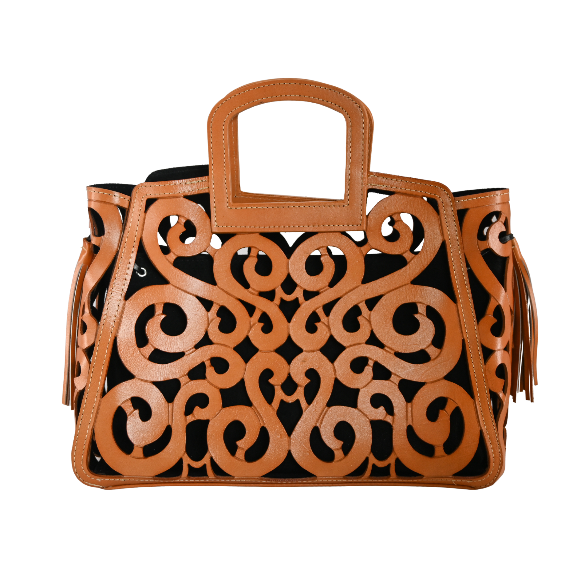 Honey leather tote with an intricate scroll pattern, black suede lining, snap closure, and leather tassels on both sides.