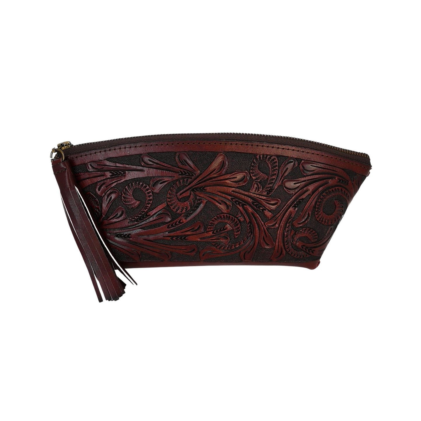 dark brown leather cosmetic bag with hand-tooled floral patterns on both sides. It has braided seams, a full zipper top, a sueded interior, a decorative tassel, and brass studs at the bottom.