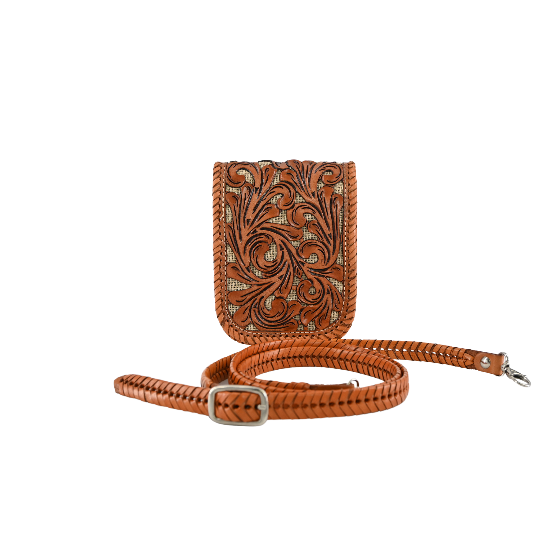 honey-colored crossbody sling bag with intricate leaf carvings on the front panel. It features a hand-braided leather strap.