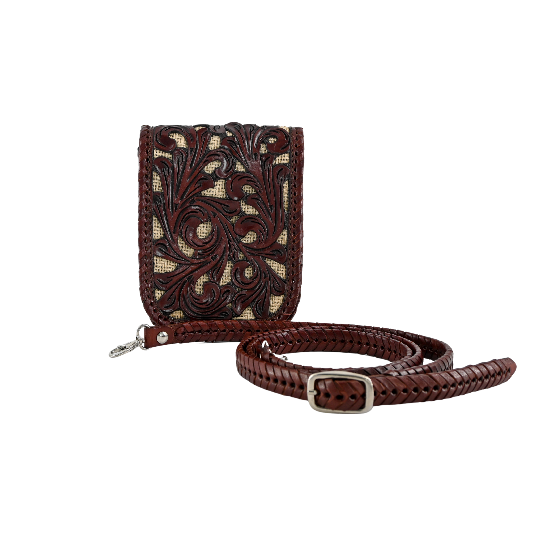 crossbody sling bag in a deep brown color with intricate leaf carvings on the front panel. It includes a hand-braided, adjustable leather strap.