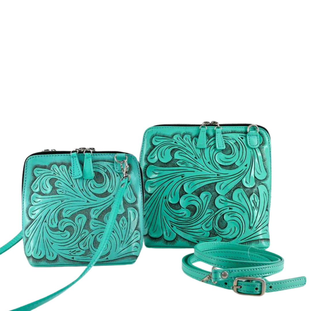 Two turquoise shoulder bags with hand-carved floral details, featuring zip-around closures and adjustable straps.