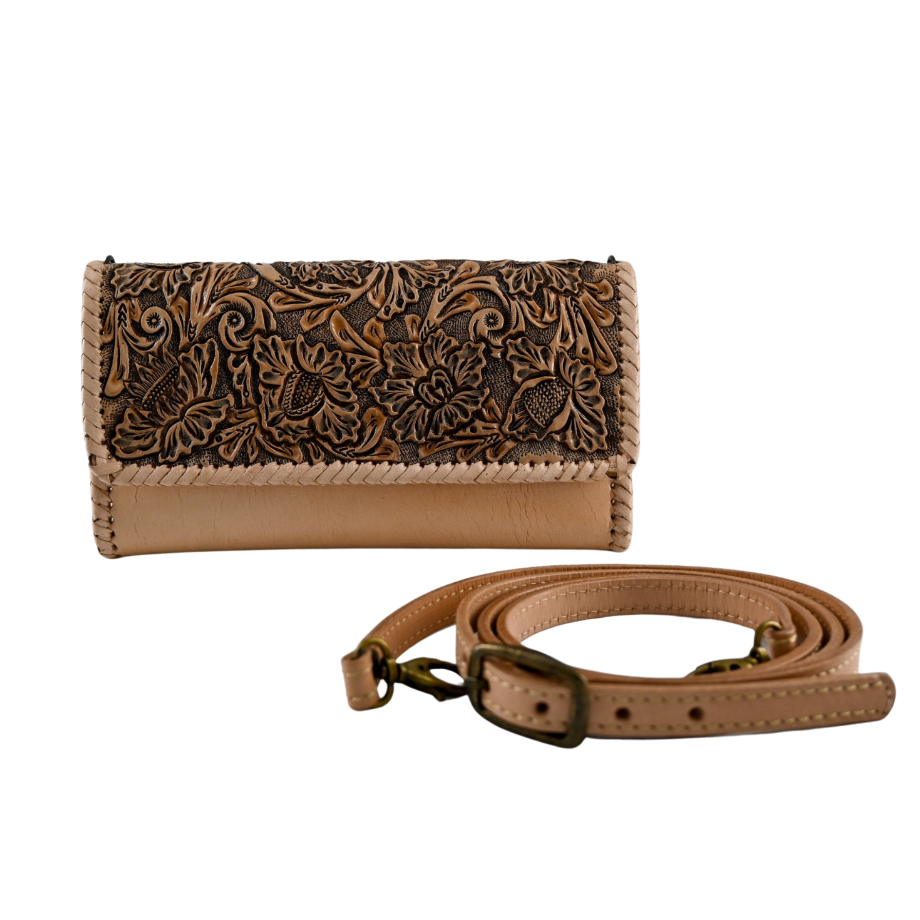 crossbody bag with detailed hand carving on the front flap, sleek nude leather body, adjustable shoulder strap, and magnetic snap closures.