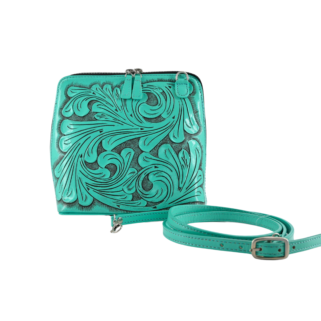 turquoise shoulder bag with hand-carved floral details, featuring a zip-around closure and an adjustable strap.