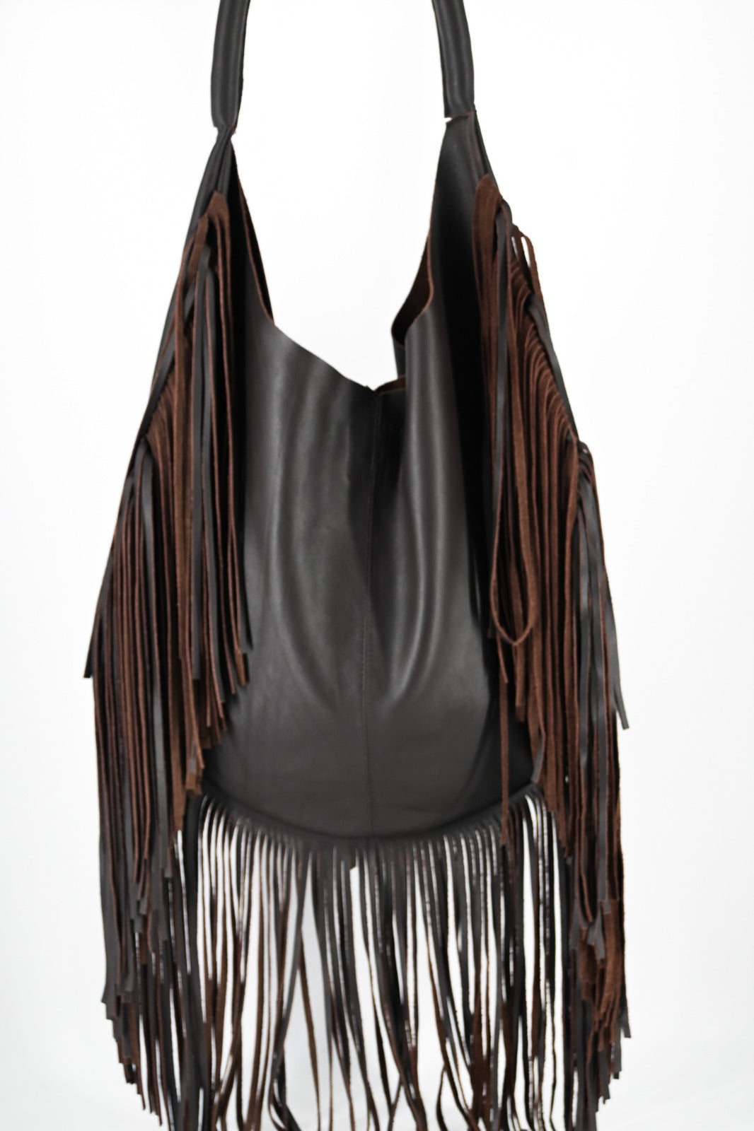 dark brown leather bag with long fringe details along the sides and bottom, featuring a padded wrapped shoulder strap.