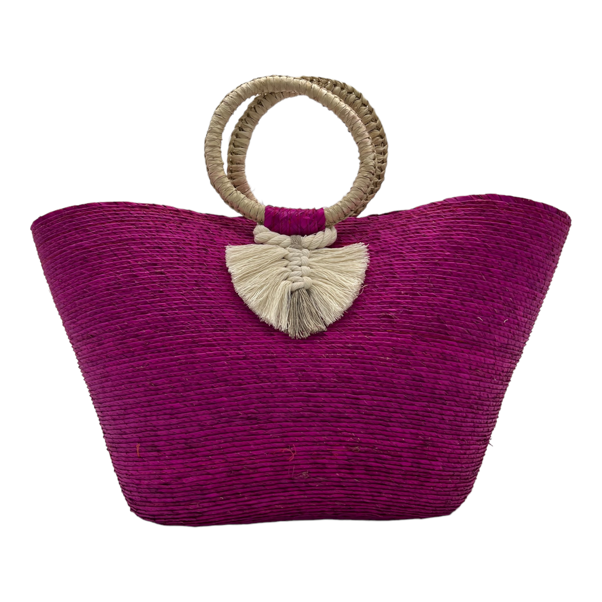 large magenta woven tote bag made of palm fibers with a circular handle. The bag features a decorative  tassel.