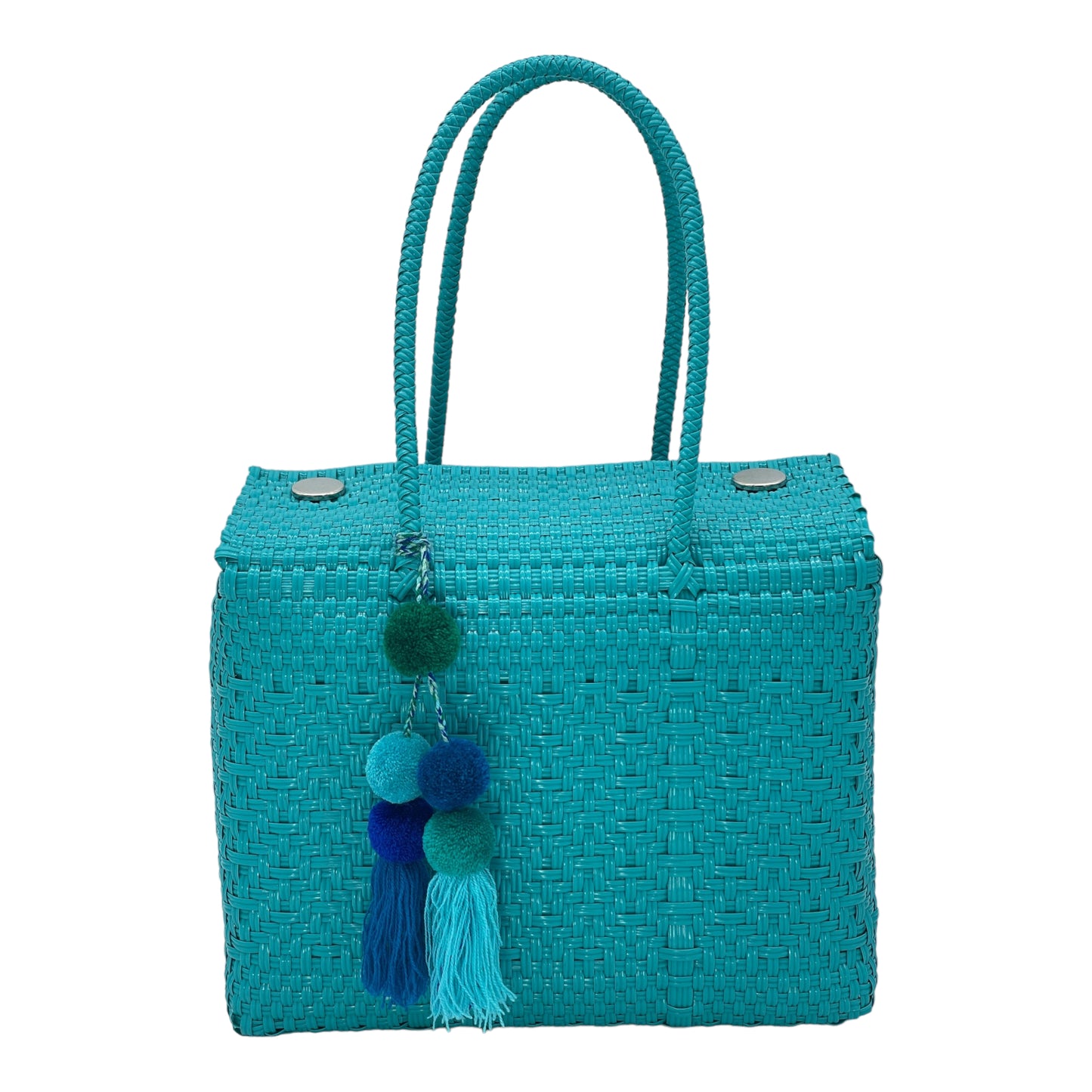 turquoise woven handbag featuring a decorative pompon.