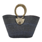 large woven tote bag in shades of gray and blue with a circular handle wrapped in natural fibers. The bag is adorned with a decorative tassel.