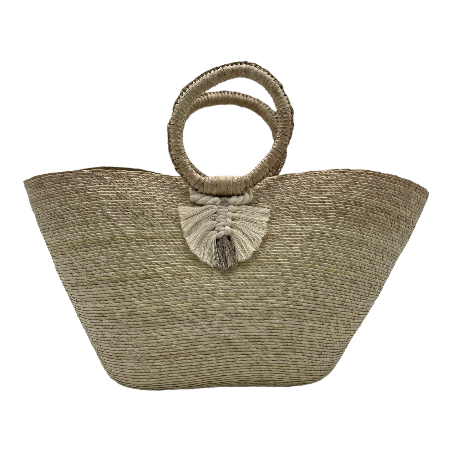 large woven tote bag made of palm fibers with a circular handle. The bag features a decorative macrame tassel 