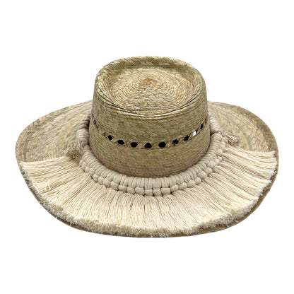 natural straw hat with a flat crown, decorated with a wide band of white tassels around the brim.