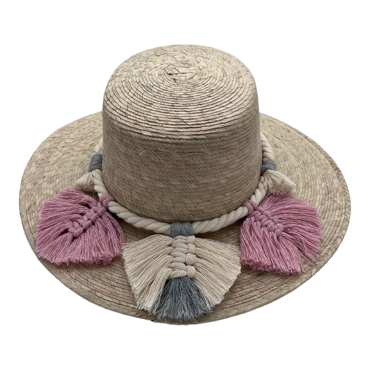 natural straw hat with a wide brim, featuring a braided band decorated with pink and white tassels.