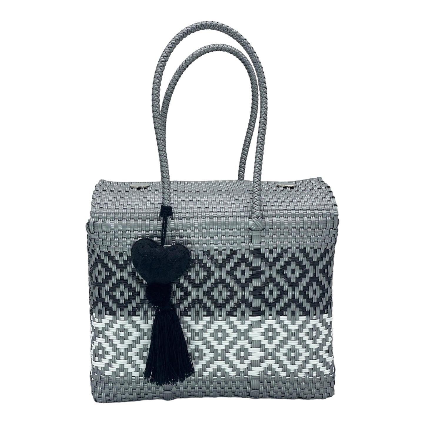 gray and black woven handbag with geometric patterns, featuring a decorative tassel with a heart.