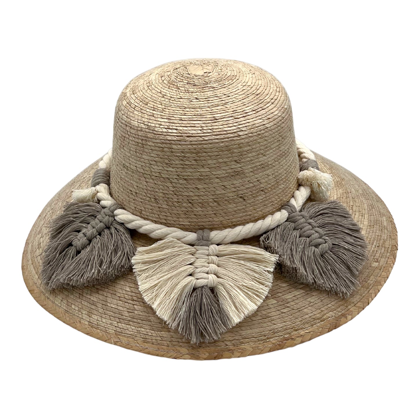 woven straw hat with a wide brim, decorated with beige and taupe tassels and a braided band around the crown. The hat has a natural straw color.