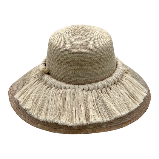 woven straw hat with a wide brim, decorated with a band of beige fringe around the base of the crown. The hat has a natural straw color.