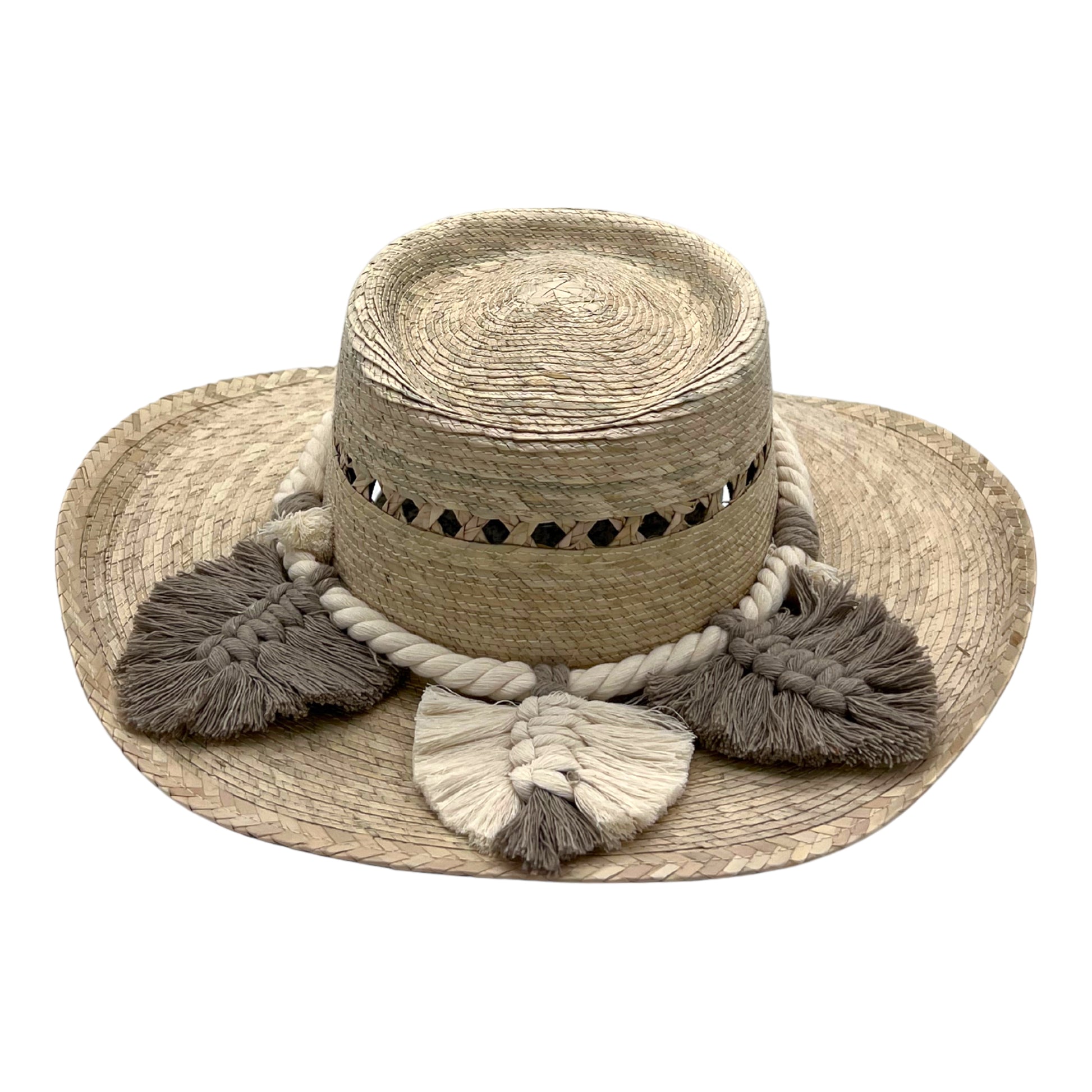 natural straw hat with a flat crown, featuring a braided white band and decorated with gray and cream tassels around the crown.