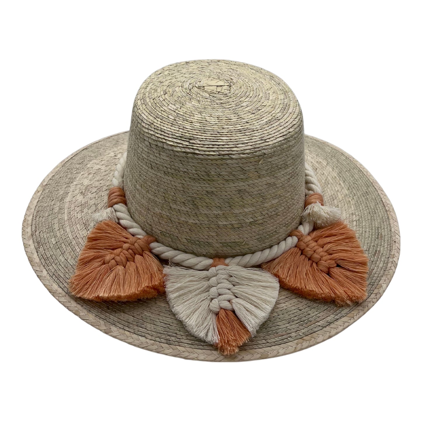 natural straw hat with a wide brim, adorned with a thick braided band and large tassels in cream and burnt orange around the crown.