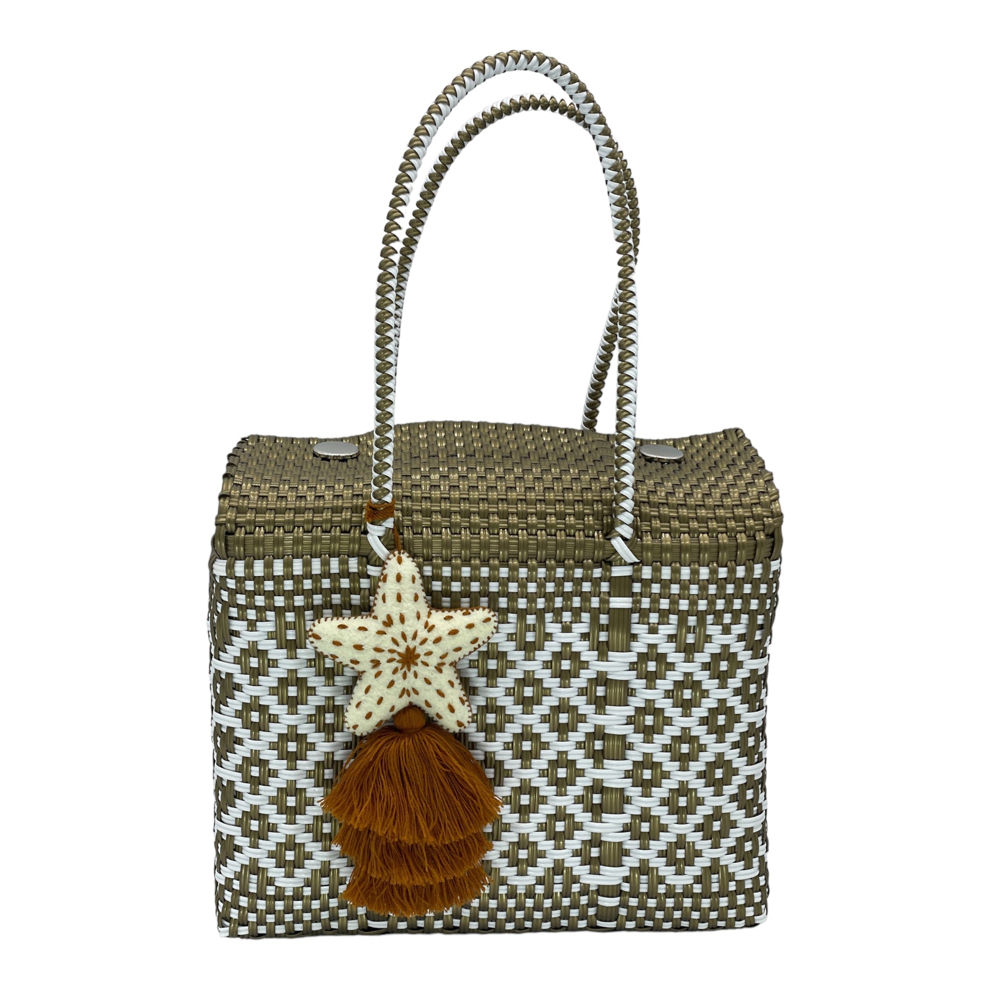 brown and white woven handbag with geometric patterns, featuring a decorative pompon with a star.