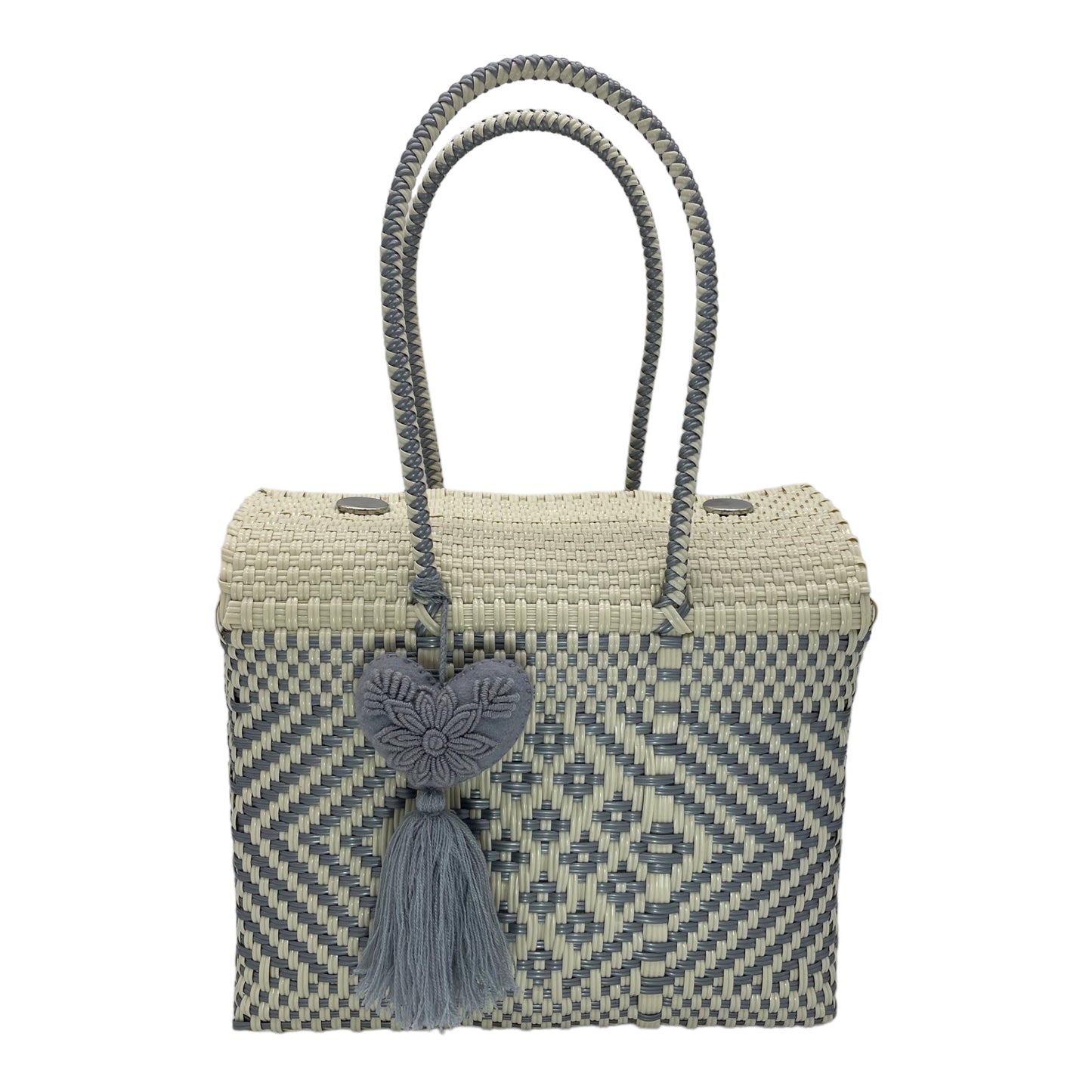 gray and white woven handbag with geometric patterns, featuring a decorative pompon with a heart.