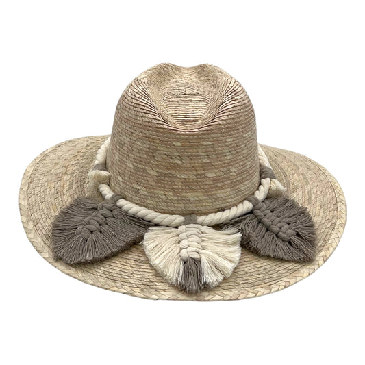 wide-brimmed, handwoven hat made of natural fibers. It features decorative tassels and braids in beige and gray shades around the base of the crown.